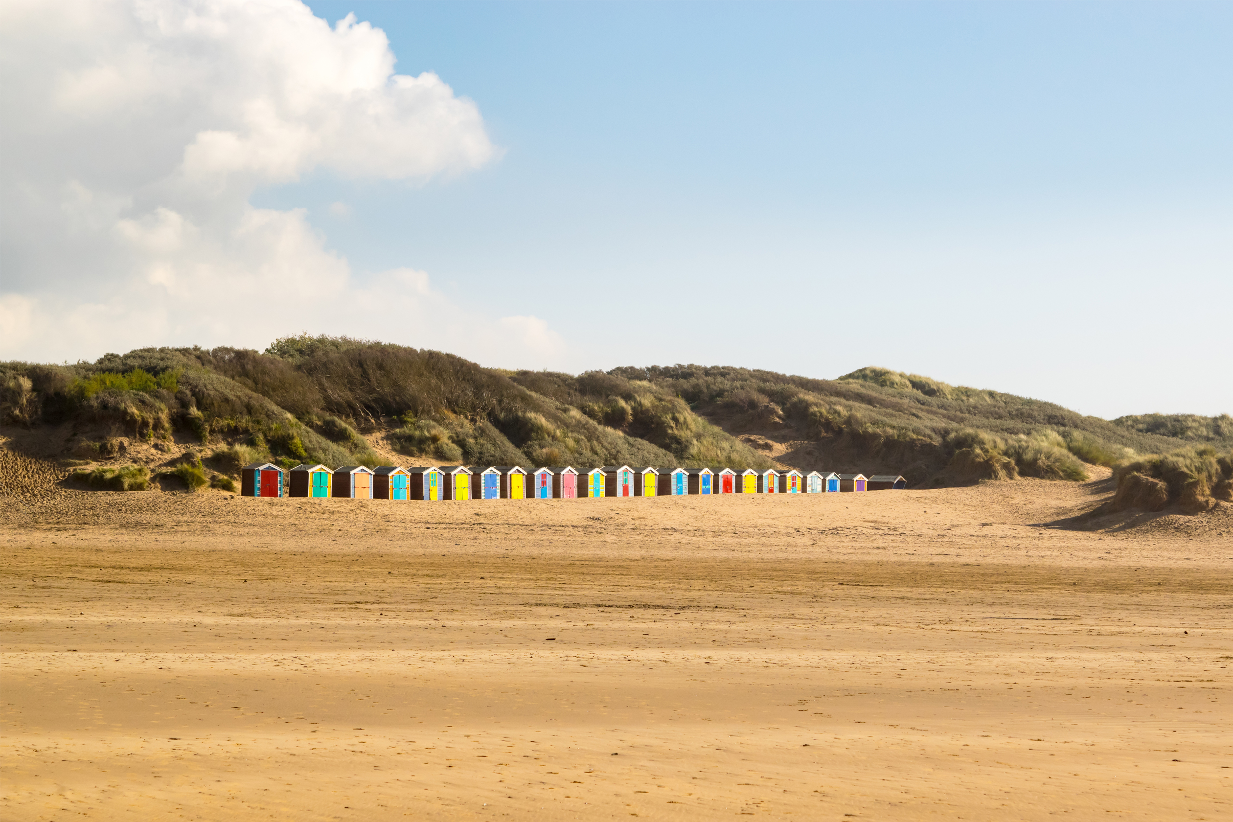 Beach huts along Saunton Sands beach, North Devon.