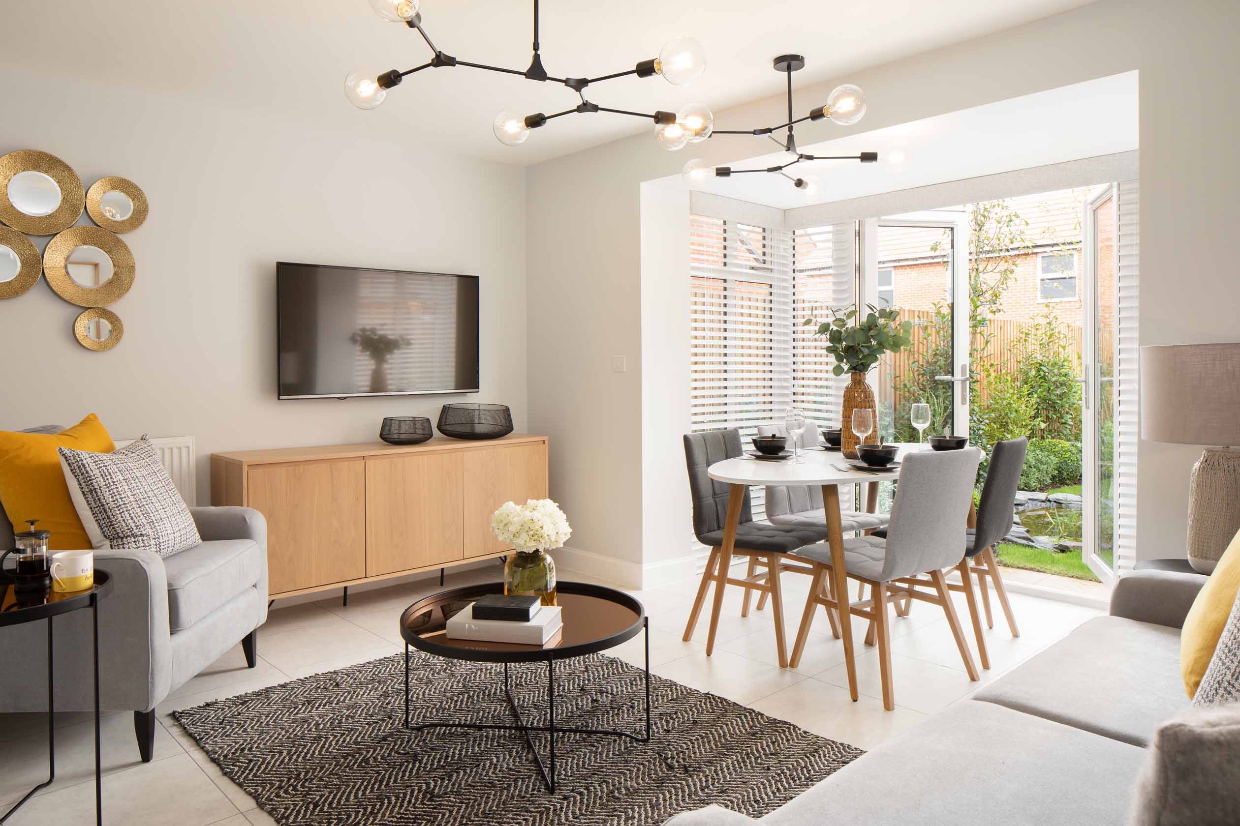 Greenwood internal show home kitchen and family room with french doors to the garden, DWH, orchard green, kingsbrook