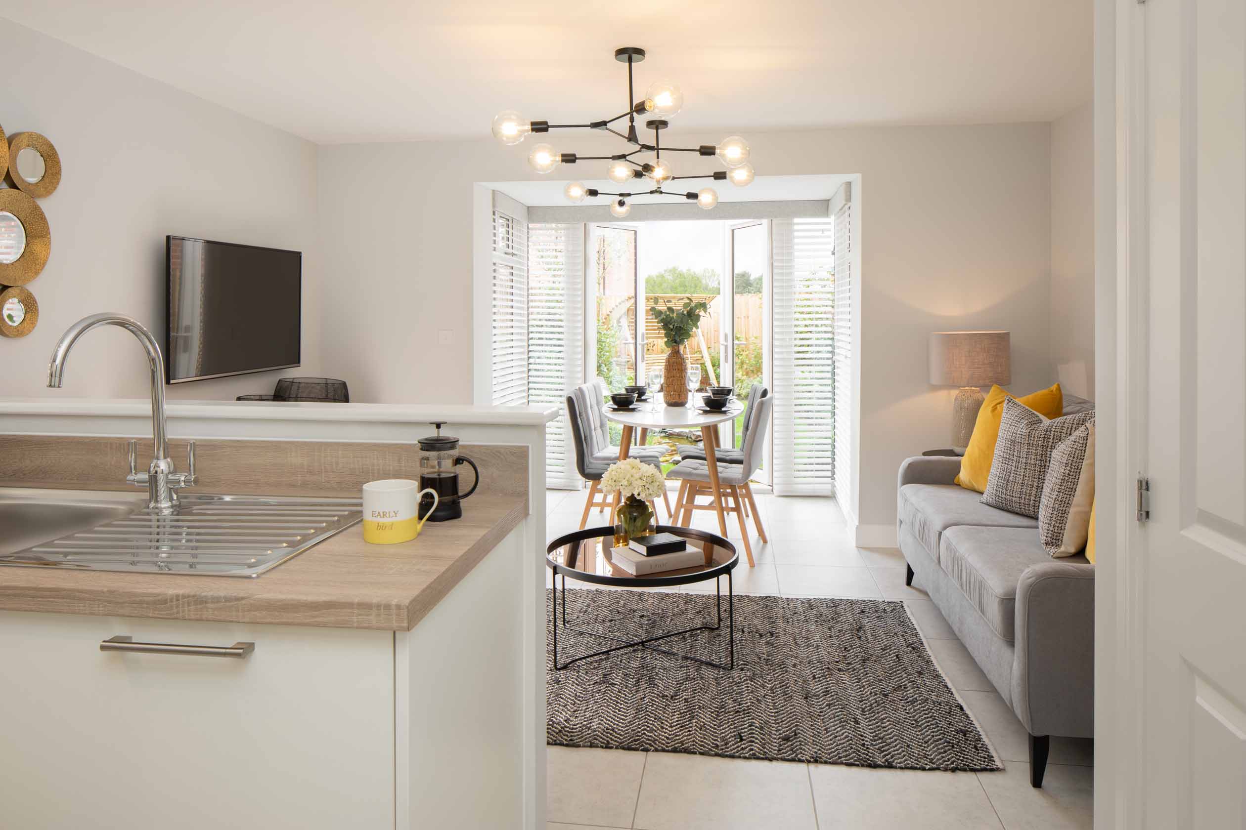 Greenwood internal show home kitchen and family room with a glazed bay, DWH, orchard green, kingsbrook