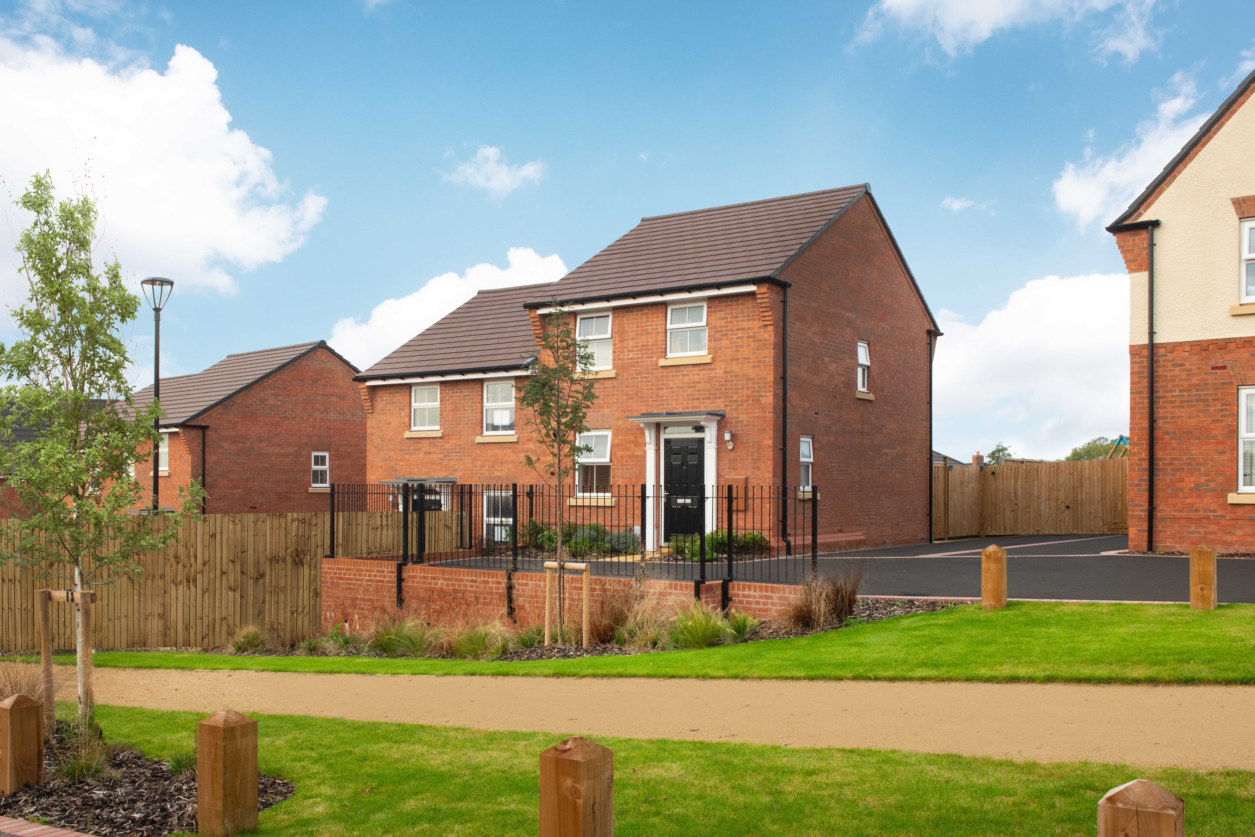 External view of homes on a tree-lined boulevard