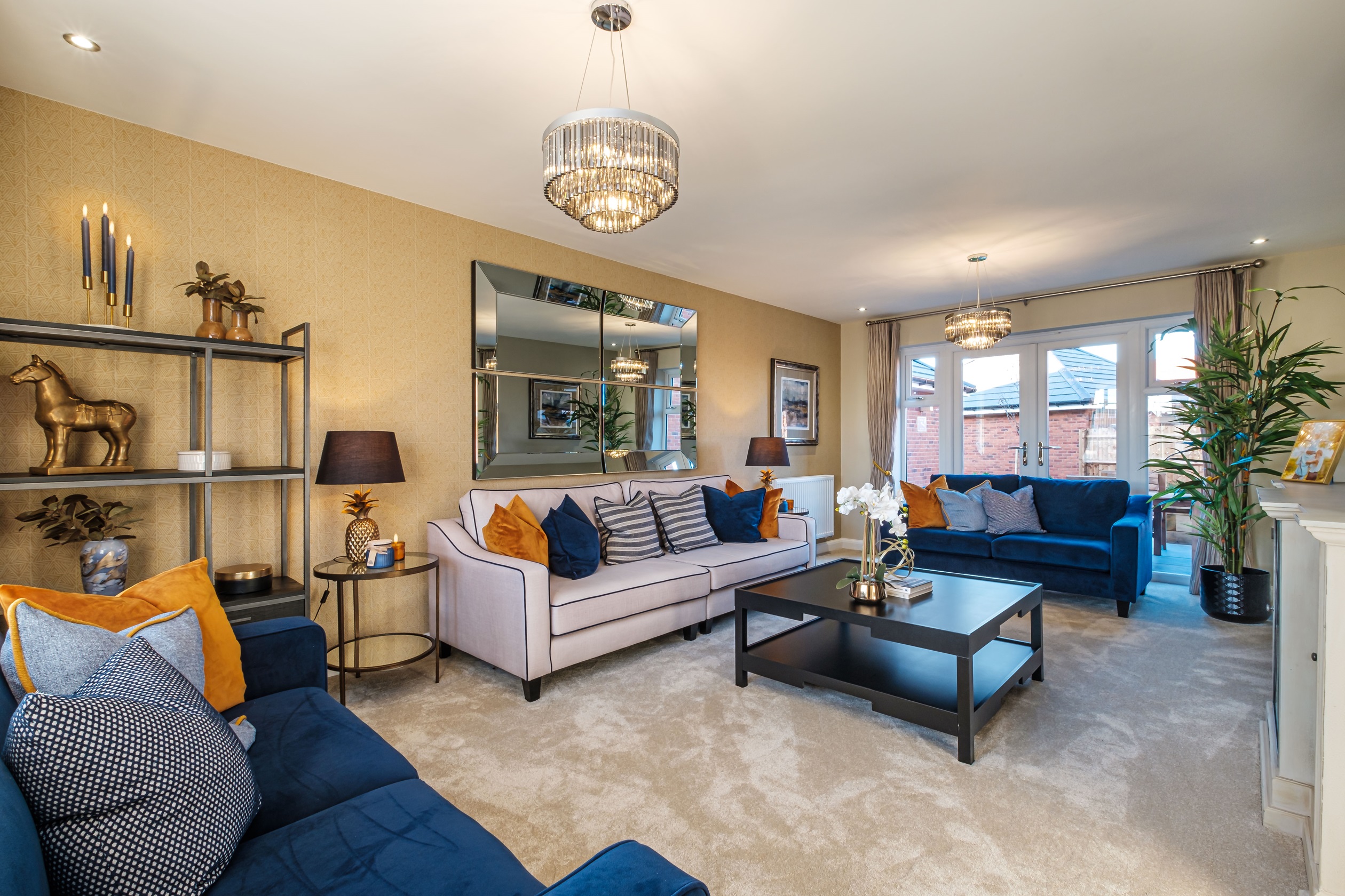 lounge with French doors to a garden at the far end