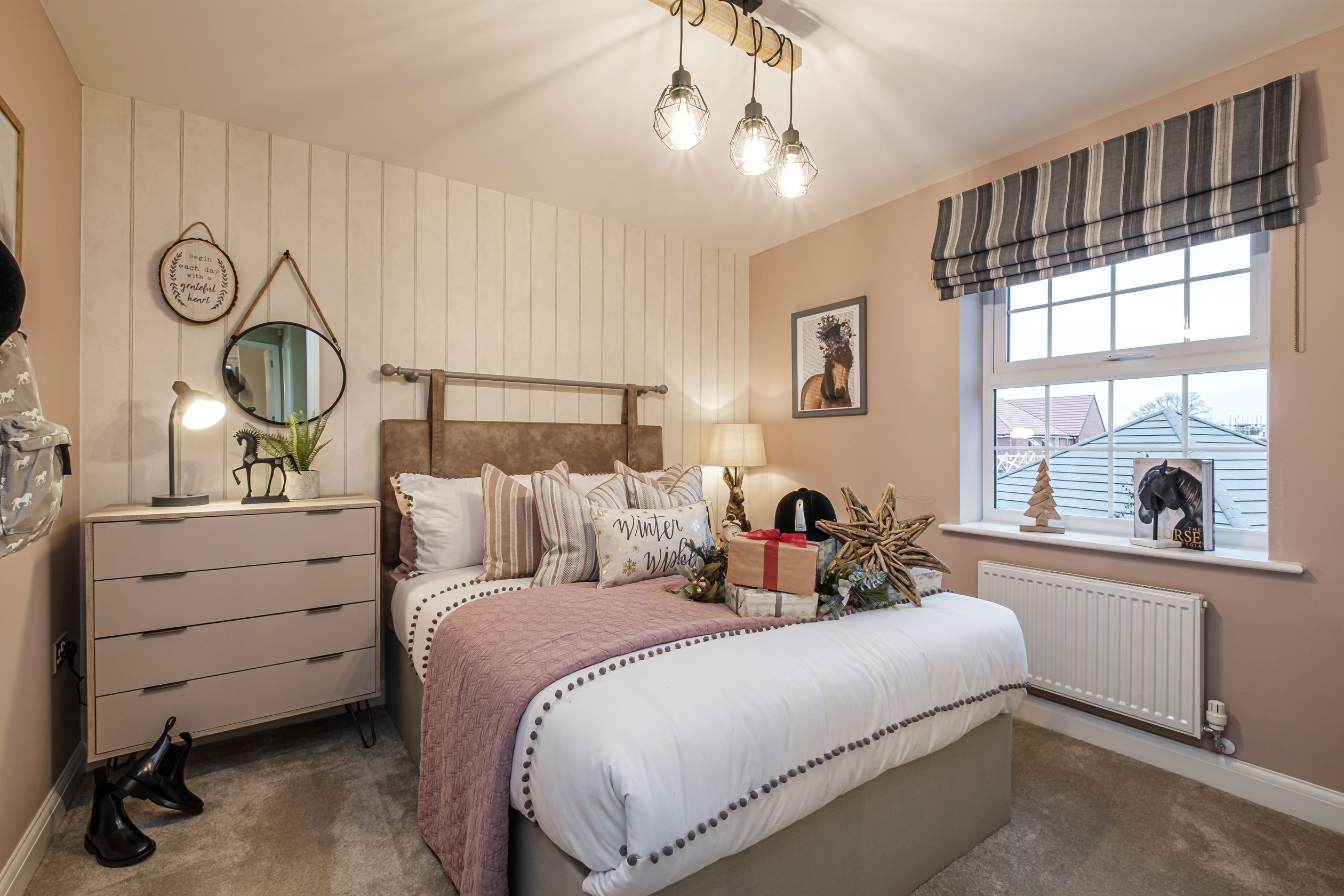 Pink themed double bedroom with large window