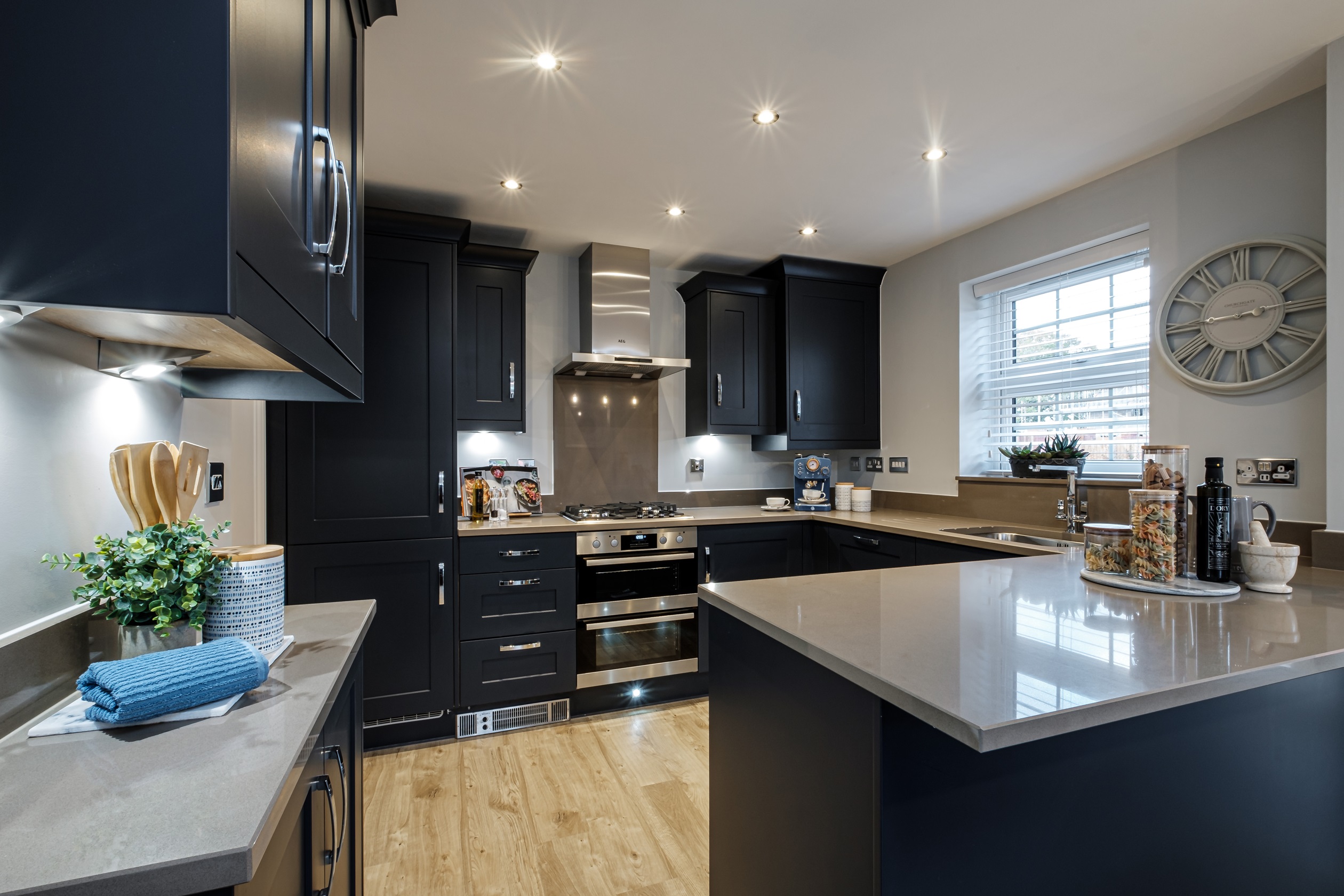 Navy blue kitchen with breakfast bar