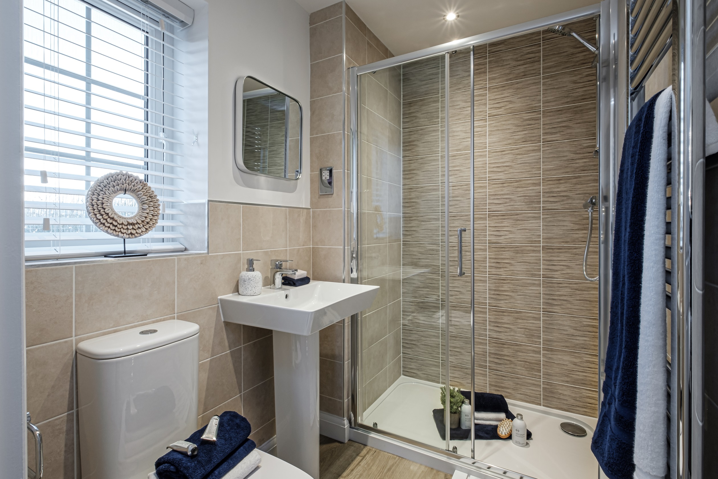 Beige tiled shower room