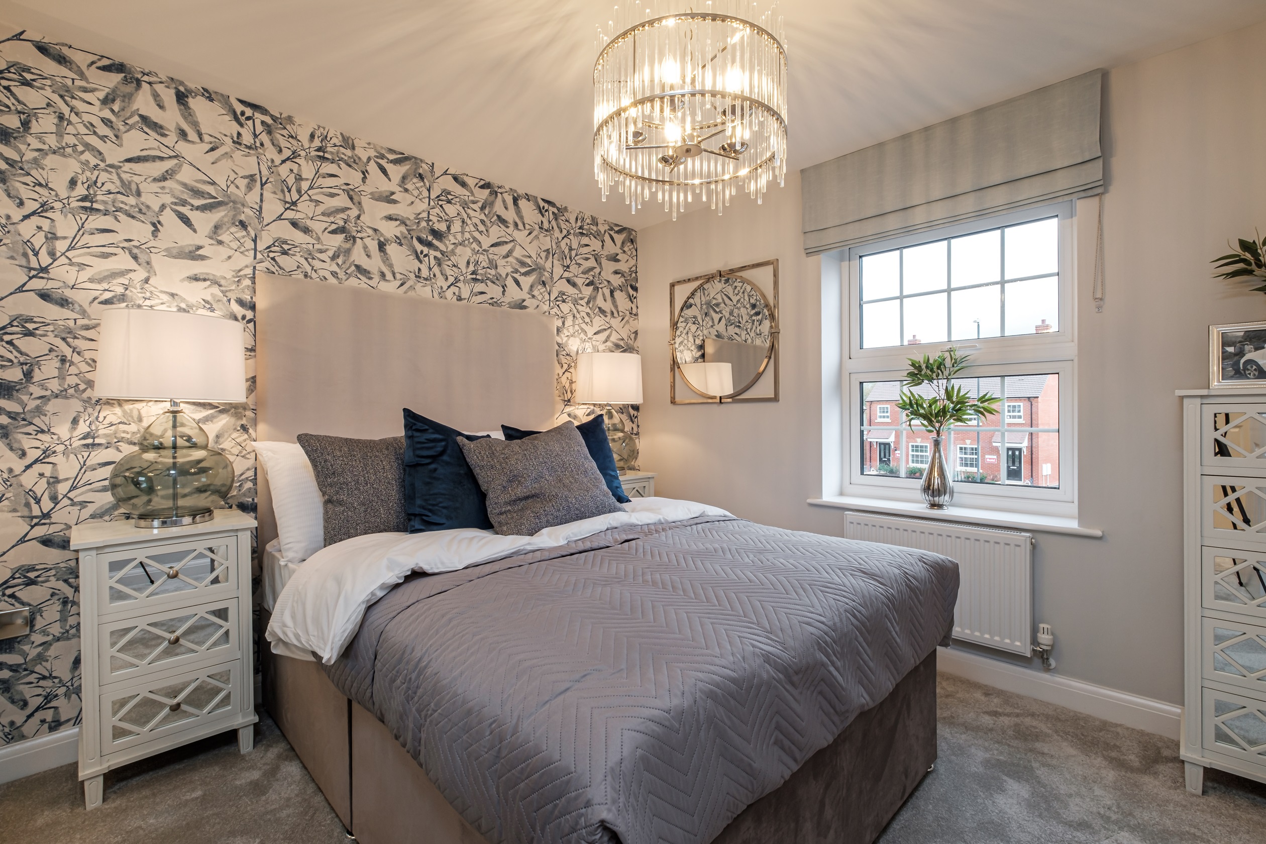 Double bedroom with floral wallpaper