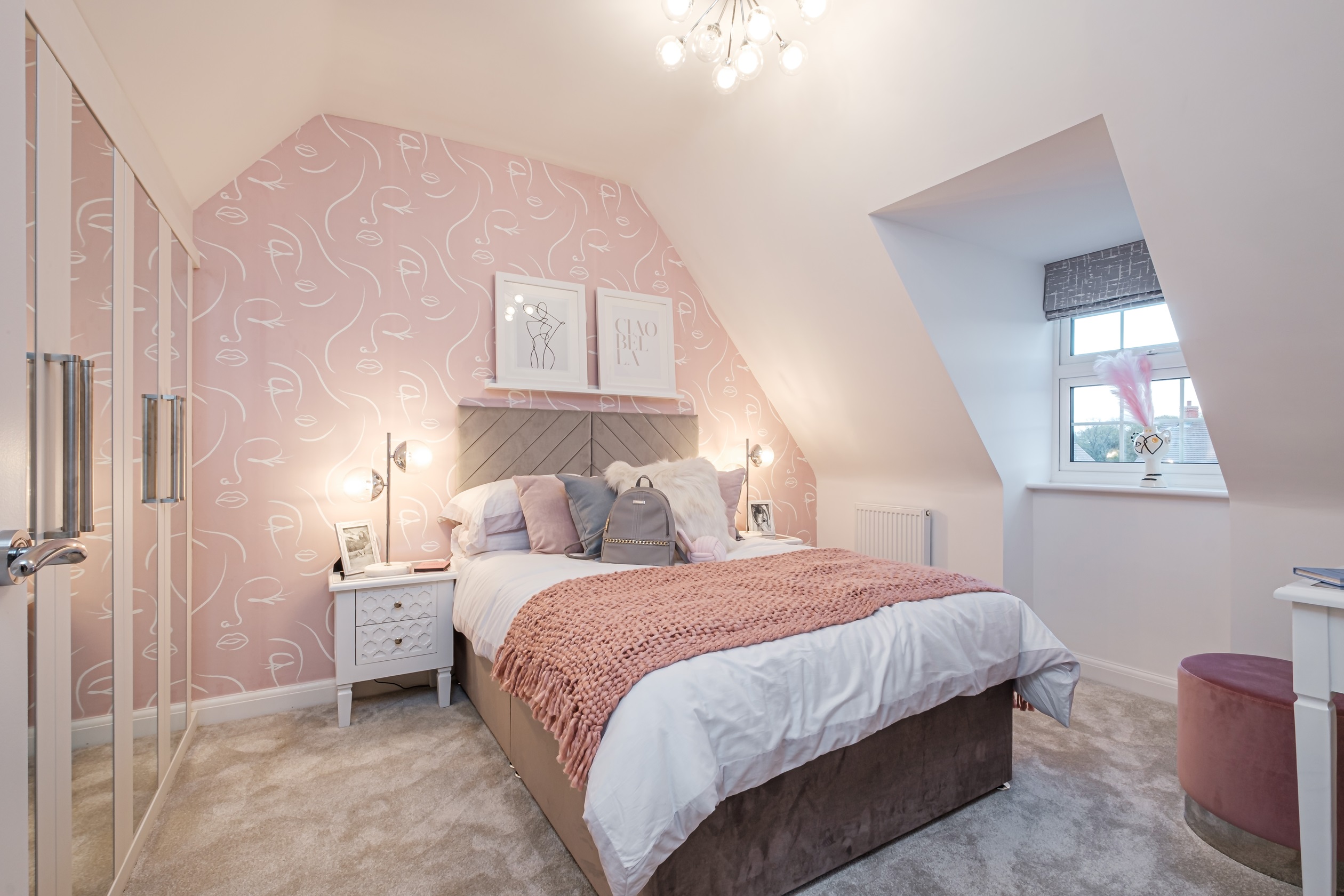Child's bedroom with pink wallpaper