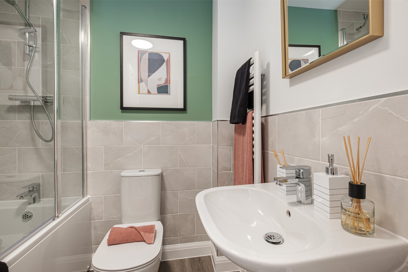 Bathroom with green painted wall above grey tiled wall