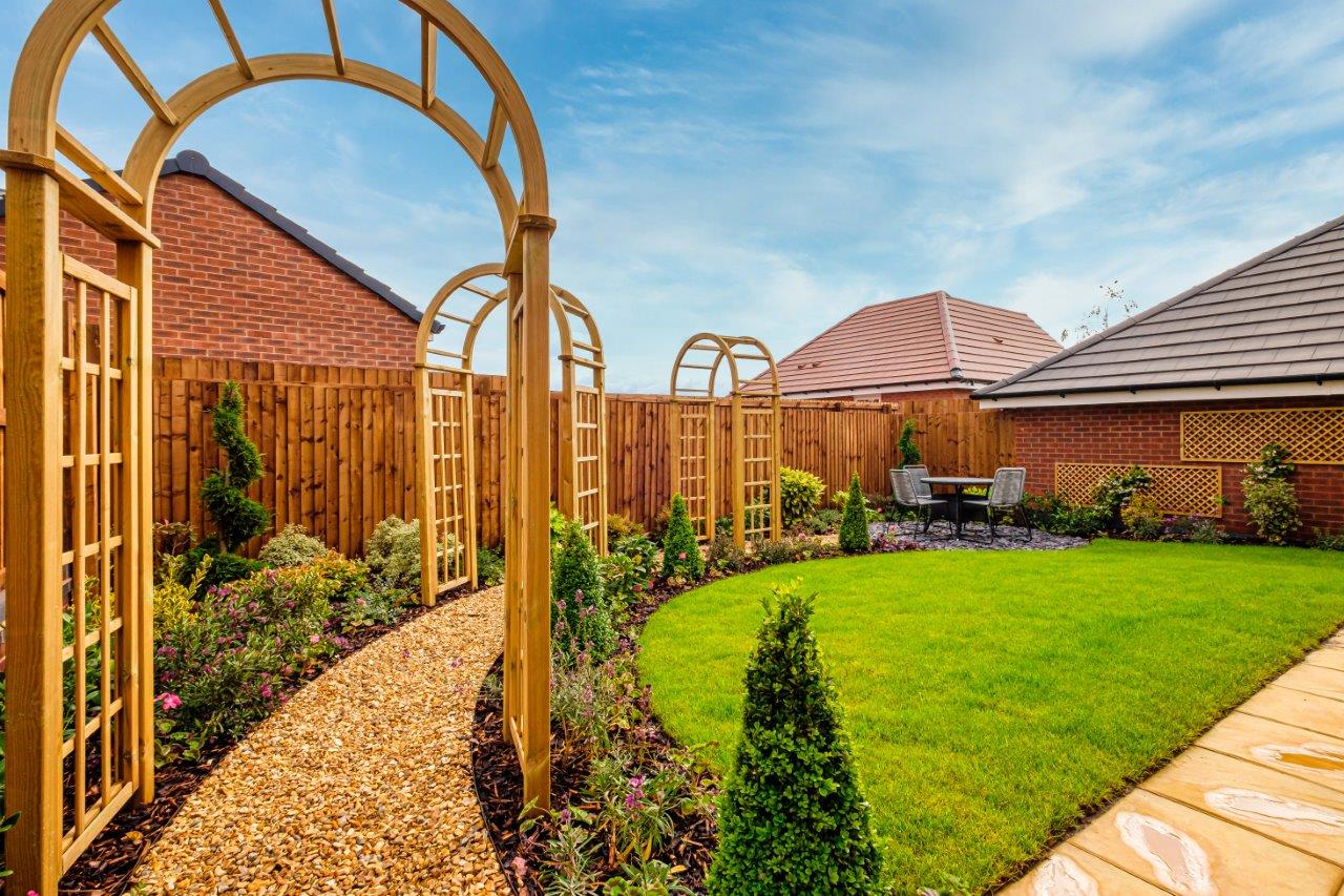 photo of a landscaped garden with pathway and turf