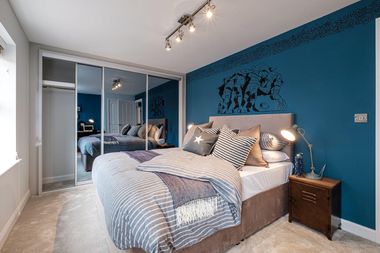 Double bedroom with dark blue walls