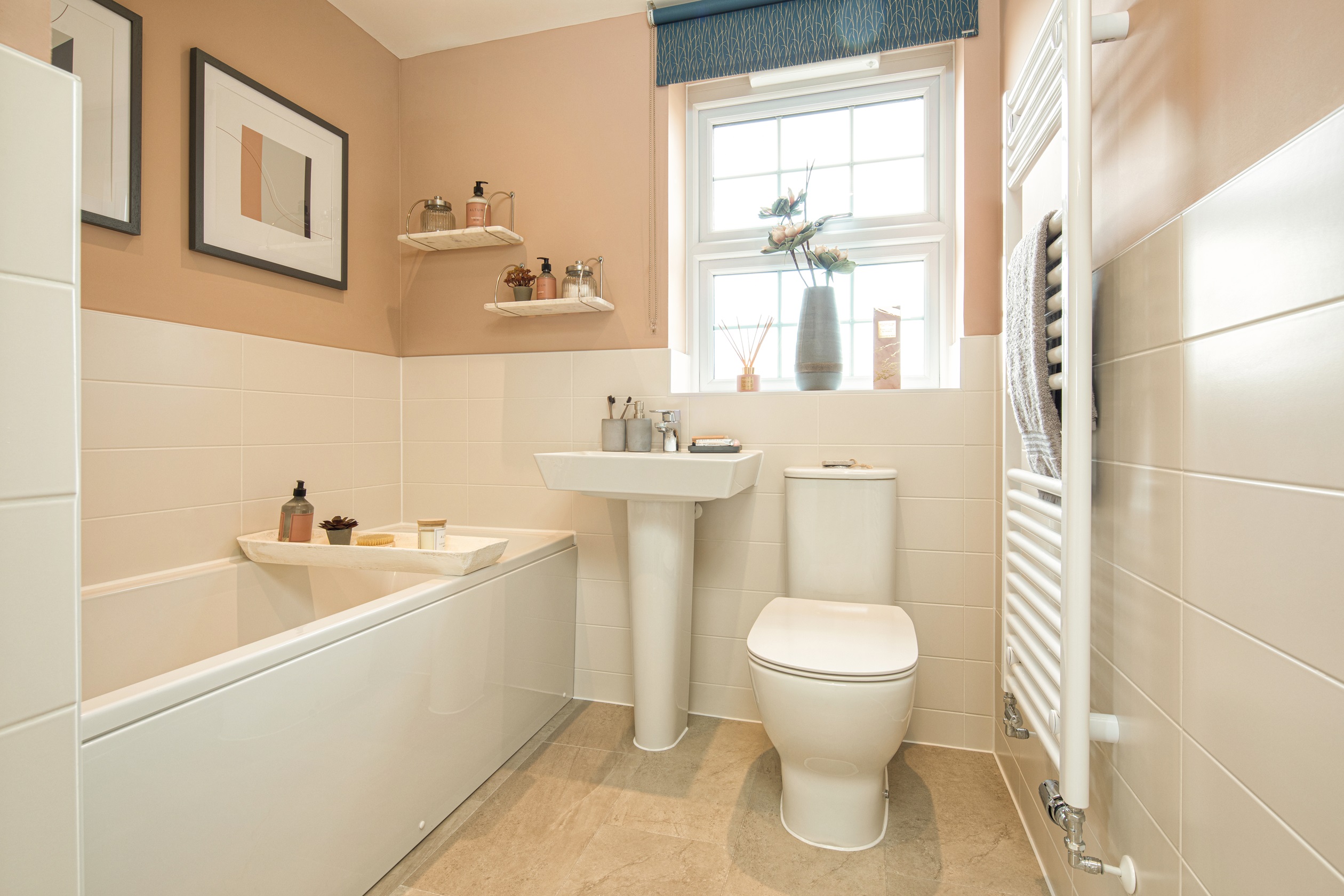 Bathroom with half tiled walls, painted blush pink above