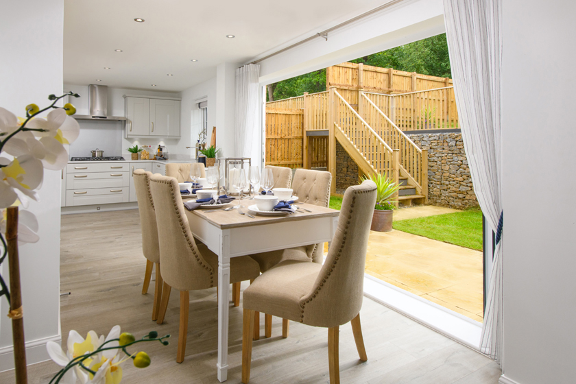 Allendale kitchen with dining area and bi-fold doors opening onto garden