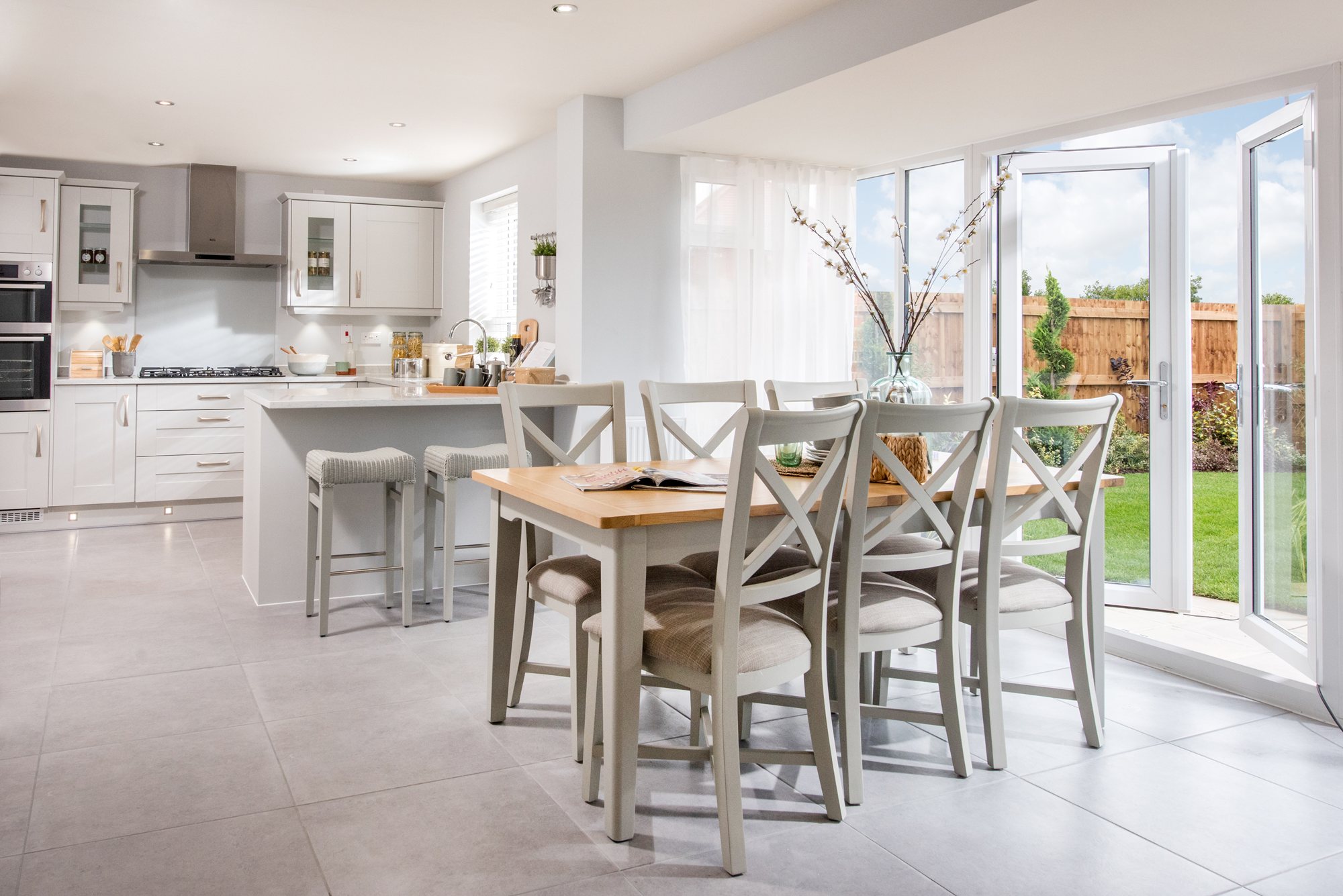 Internal shot of Bradgate style kitchen, with french doors leading to garden