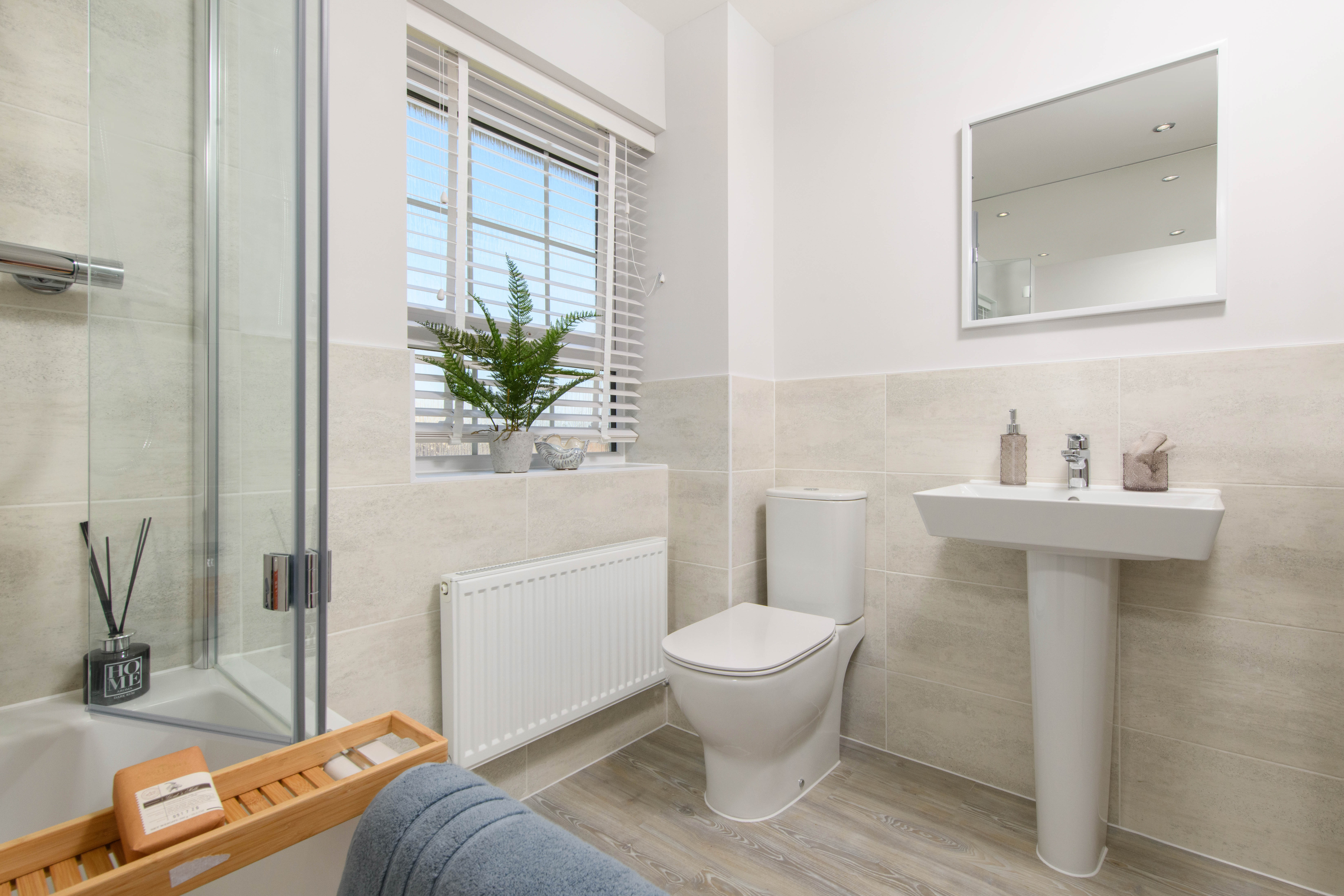 Family bathroom with shower over bath and 2 years fixtures & fittings guarantee