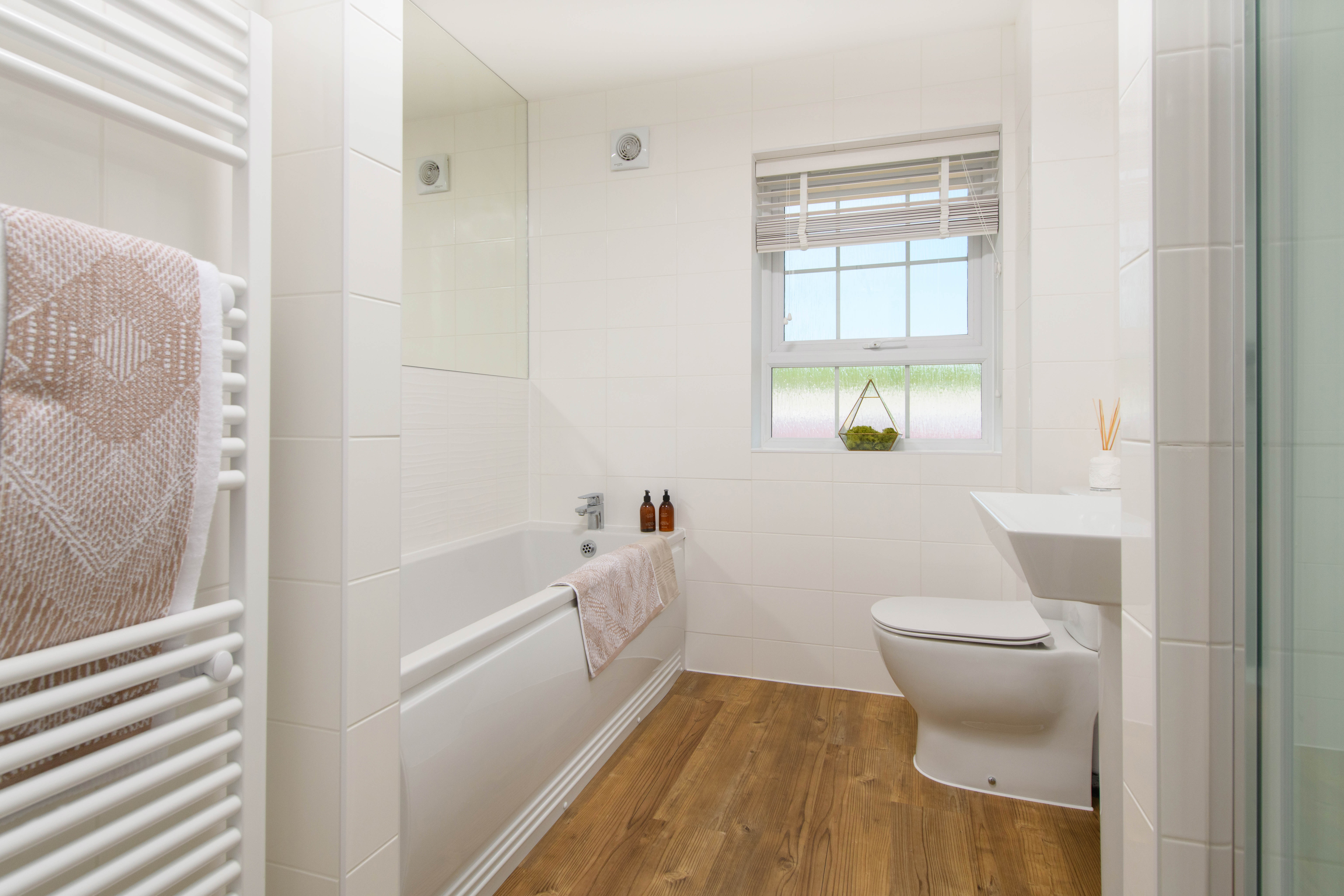 Family bathroom with shower over bath & storage