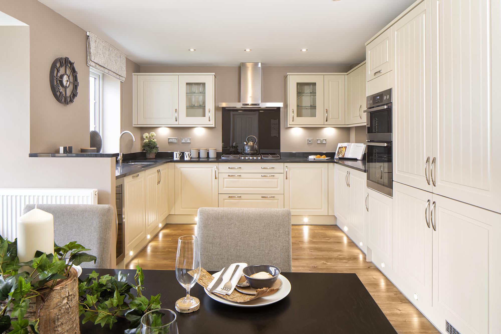 Open-plan kitchen with family and dining areas