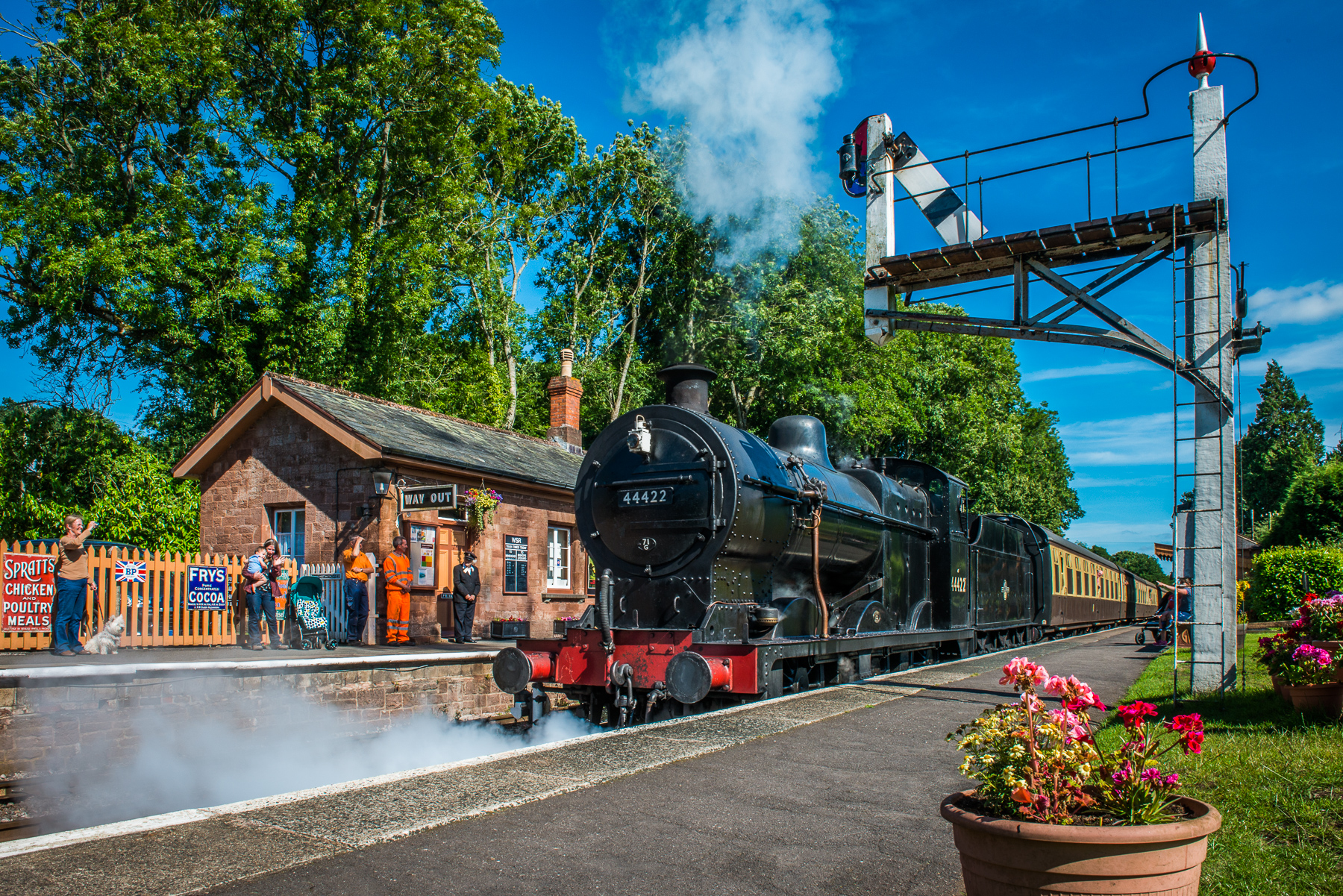 Taunton train station with train stopped at a station