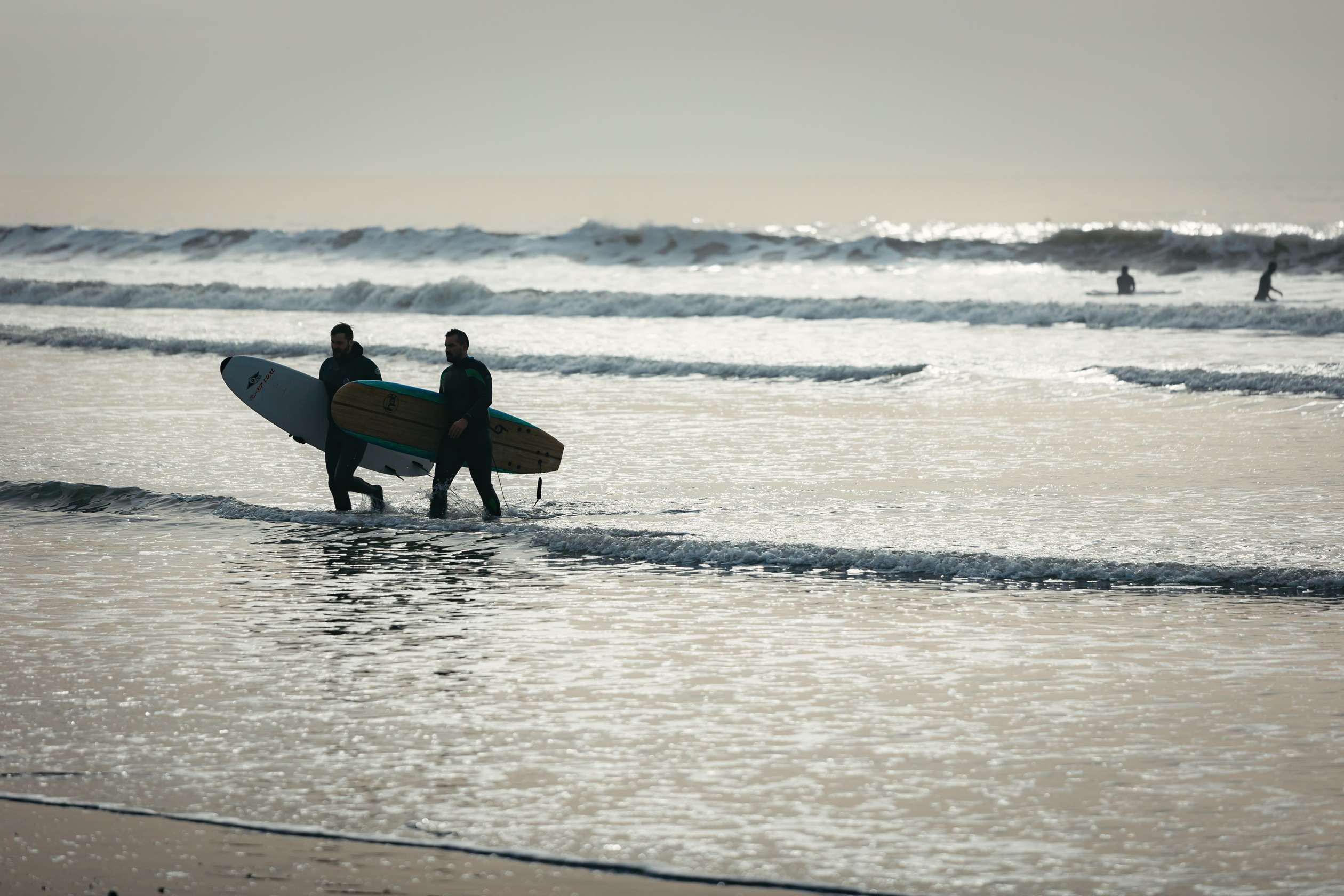 Local area shot of surfers at bracklesham bay/east-wittering beach