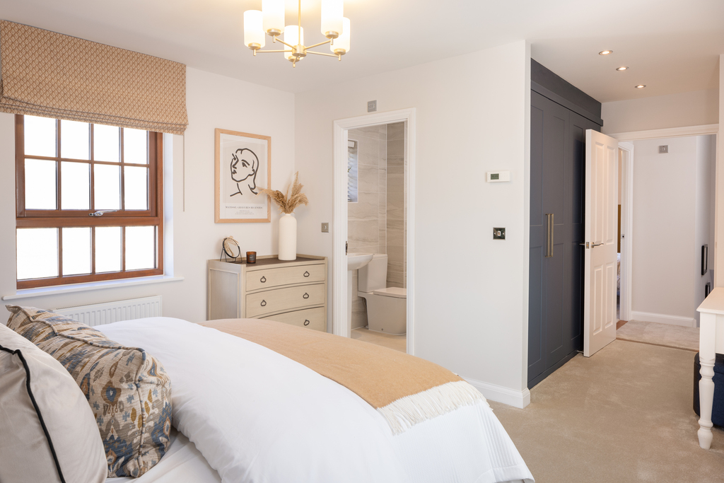 Internal shot of the main bedroom en suite and dressing area in the conwy show home