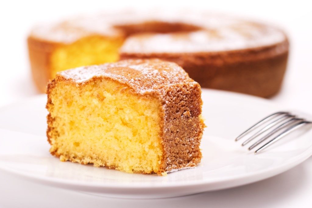 Lemon sponge cake on plate with fork