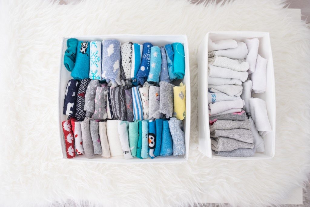 Image of very organised drawer filled with clothes using the konmari method