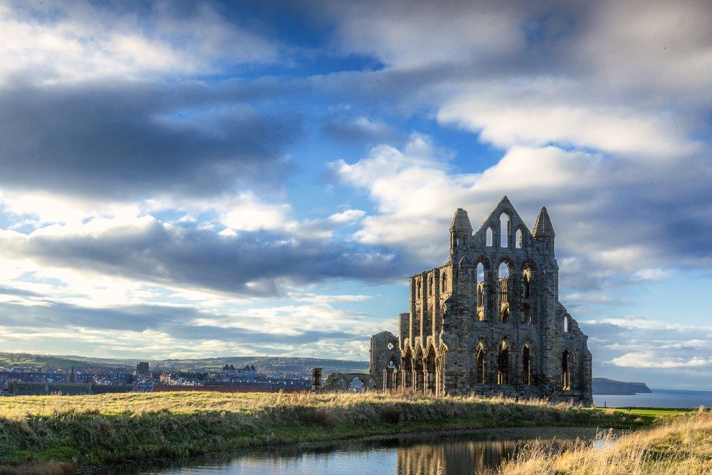 Dramatic picture taken of Whitby Abbey on an overcast day with dark clouds.