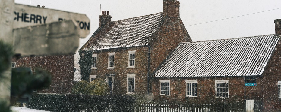Old home covered in snow